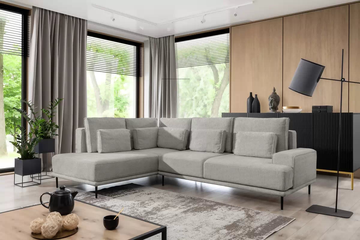 Rozkládací rohová sedací souprava Nicole L levá - šedá látka Hevia 207.17 / černé nožky Rohová sedací souprava do obývacího pokoje Nicole L levá - šedá potahová látka Hevia 207.17/nozki černá