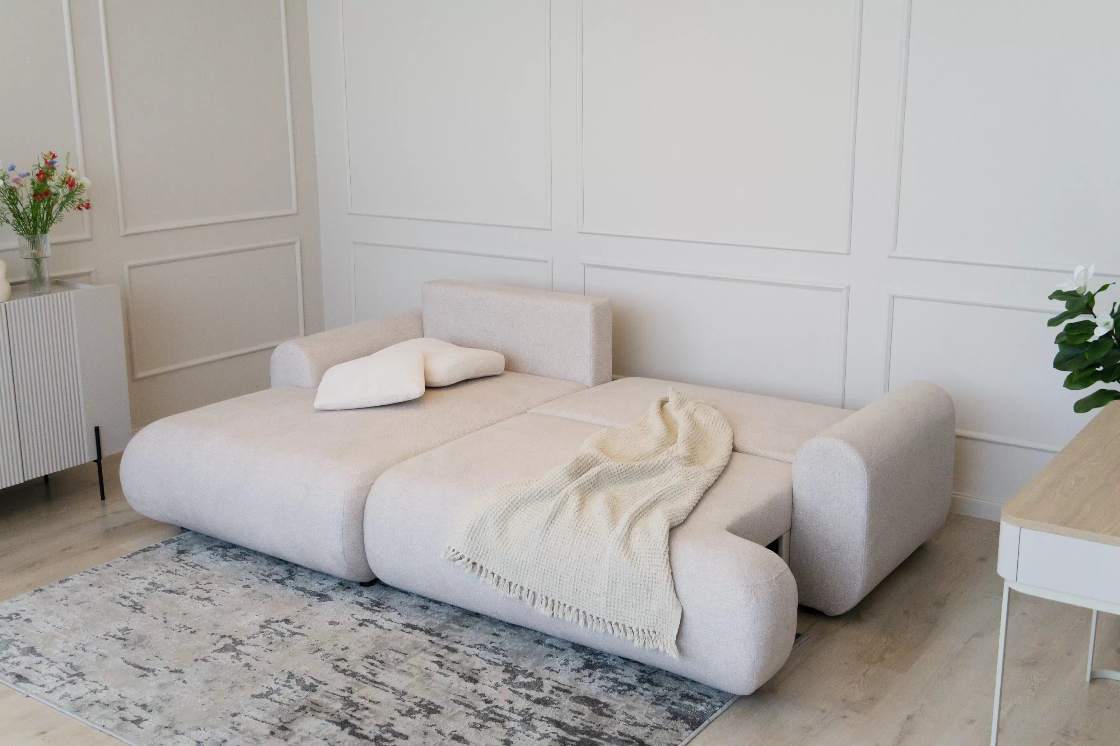 Rohová sedačka Lotulis Mini s rozkladom ľavostranná - krémová hydrofóbna látka Blur 01 Rohová sedacia súprava Lotulis Mini s funkciou spánku Ľavá strana - kremowa dzianina hydrofobowa Blur 01 