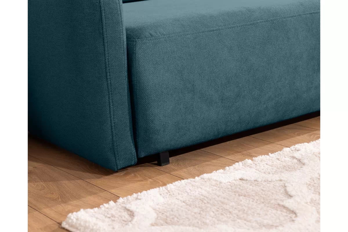 Pohovka Zeldia 155 s funkciou spánku - Modrý šenil hydrofobowy Spring 1117 Pohovka Zeldia 130 s funkciou spania - Modrý šenil hydrofobowy Spring 1117